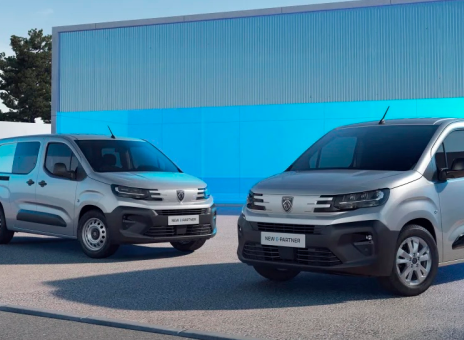 Two Peugeot brand utility vehicles